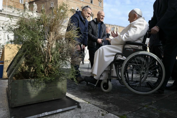 Pope Francis greets pilgrims while seated in a wheelchair during his general audience on Wednesday, Dec. 4, 2024. Credit: Vatican Media