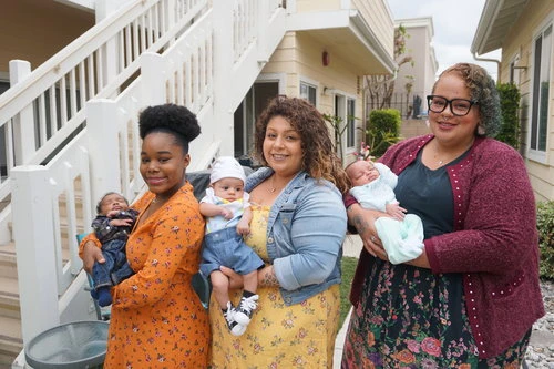 Moms hold their babies in front of a Precious Life maternity home in Orange County, California. Precious Life opened in 1989 and provides emergency and transitional housing and support for mothers in need. Credit: Precious Life