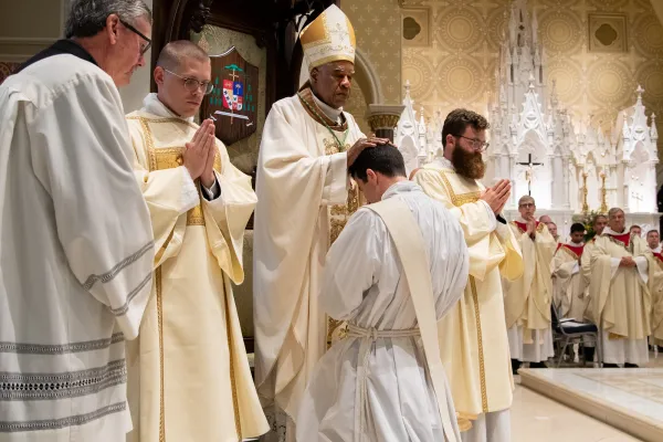 Bishop Jacques Fabres-Jeune lays hands on a newly ordained priest at the Cathedral of Saint John the Baptist in Charleston, South Carolina, on June 7, 2024. Photo credit: The Catholic Miscellany/Doug Deas