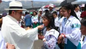 A priest gives Communion to children at the 53rd International Eucharistic Congress in Quito, Ecuador, on Sunday, Sept. 8, 2024.