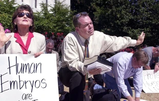 Longtime pro-life activist Eva Edl (left) prays in front of a Senate office building on Capitol Hill, Sept. 6, 2001, to protest President George W. Bush's decision to allow limited stem cell research. Credit: MIKE THEILER/AFP via Getty Images