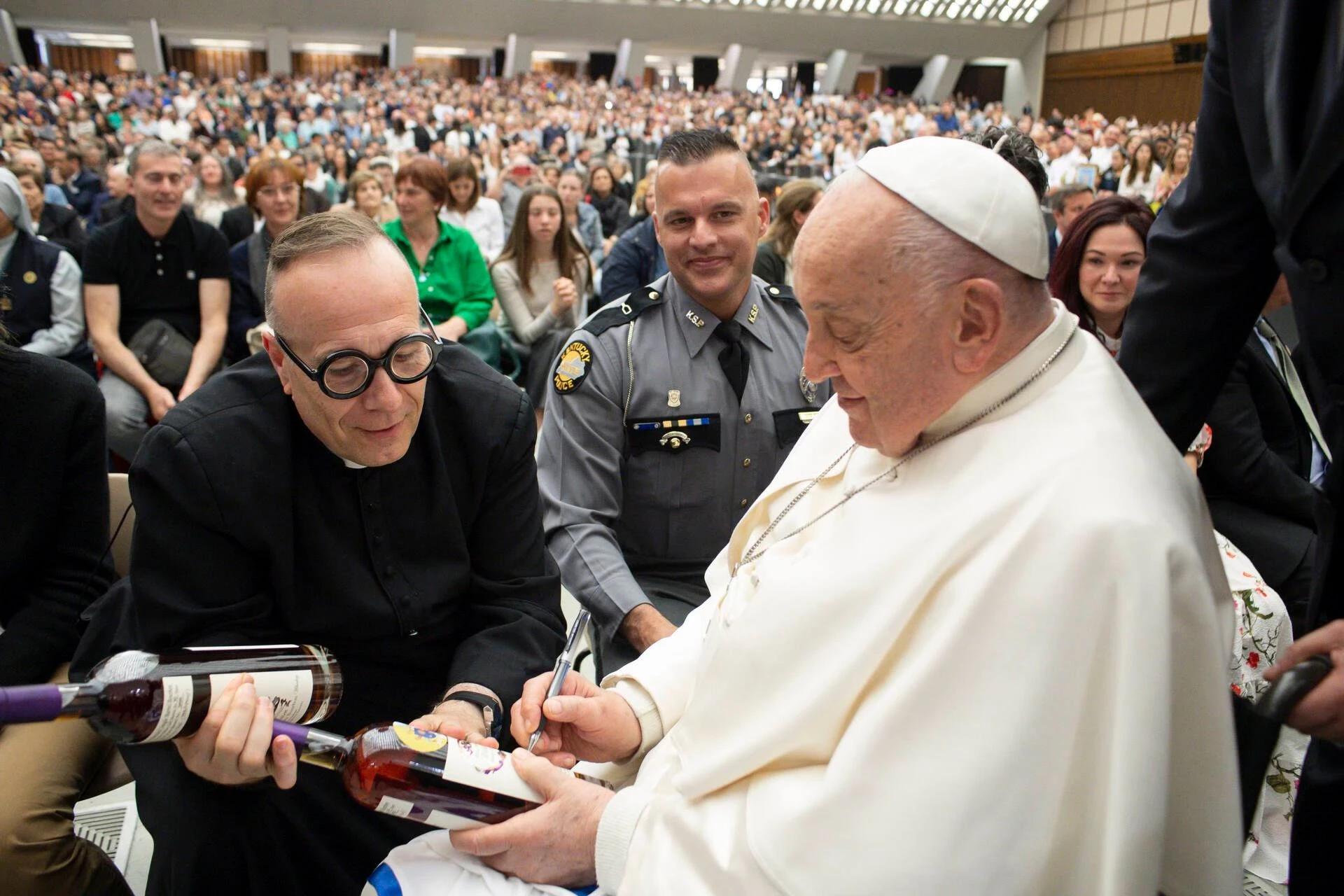 Pope Francis signs two bottles of bourbon presented to him by Father Jim Sichko at the Vatican on May 1, 2024.?w=200&h=150