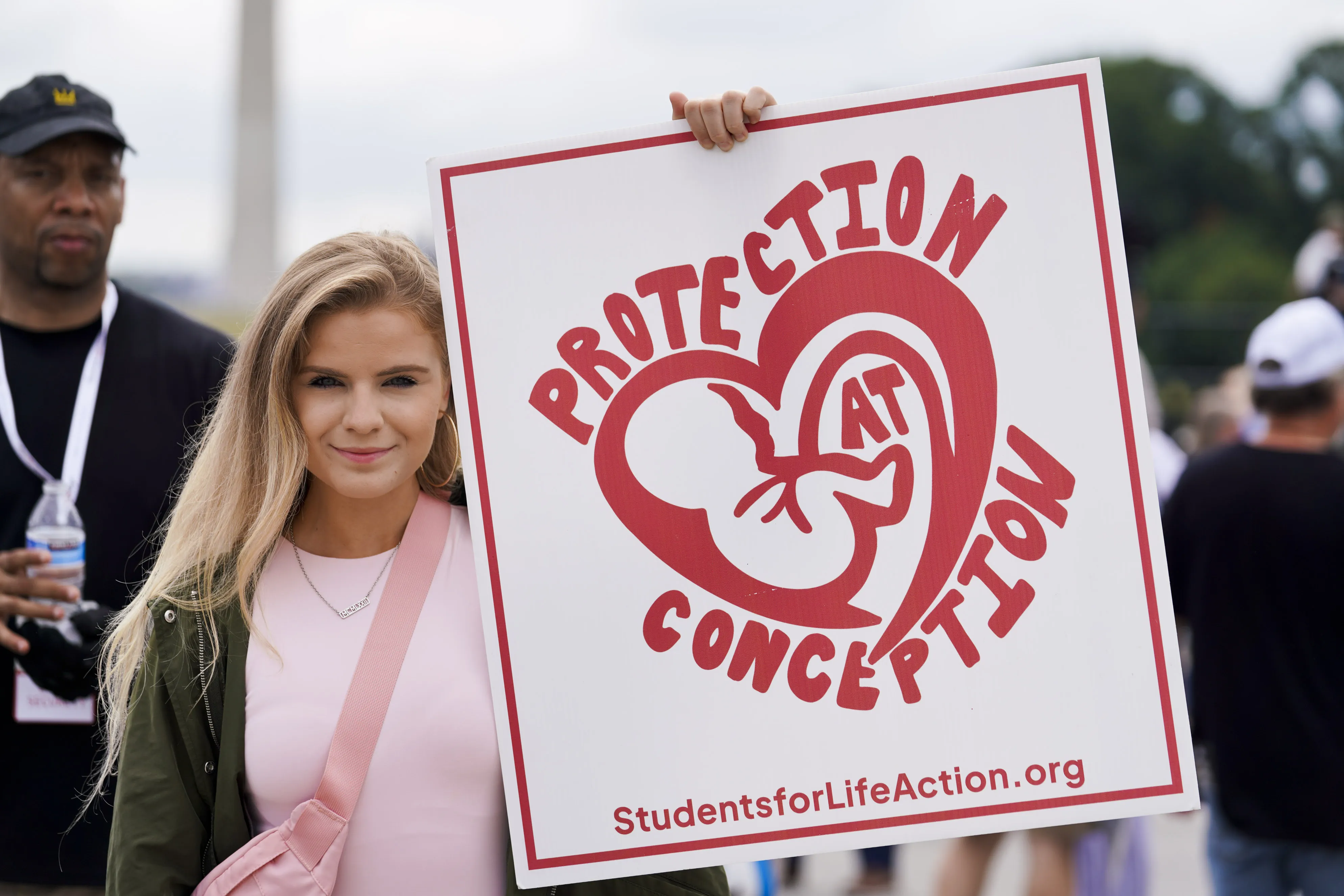 A young woman holds a pro-life sign during a rally in front of the Lincoln Memorial in Washington, D.C., on June 24, 2023, marking the first anniversary of the Supreme Court's Dobbs decision that overturned Roe v. Wade.?w=200&h=150