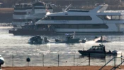 Emergency response units search the wreckage on Jan. 30, 2025, of an American Airlines plane on the Potomac River after it crashed on approach to Reagan National Airport the night before. The American Airlines flight from Wichita, Kansas, collided midair with a military Black Hawk helicopter while on approach to Ronald Reagan Washington National Airport. According to reports, there were no survivors among the 67 people on both aircraft.