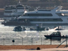 Emergency response units search the wreckage on Jan. 30, 2025, of an American Airlines plane on the Potomac River after it crashed on approach to Reagan National Airport the night before. The American Airlines flight from Wichita, Kansas, collided midair with a military Black Hawk helicopter while on approach to Ronald Reagan Washington National Airport. According to reports, there were no survivors among the 67 people on both aircraft.