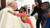 Pope Francis at the apostolic nunciature in Jakarta with refugee children.