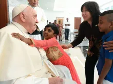 Pope Francis at the apostolic nunciature in Jakarta with refugee children.