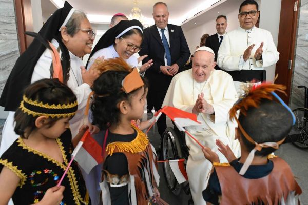 Children being raised by Dominican nuns welcome the Holy Father in traditional dress. Credit: Vatican Media