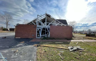 A Marian statue stands before Resurrection Catholic Church in Dawson Springs, Ky., after the church was heavily damaged by a tornado Nov. 11, 2021. Photo courtesy of Fr. Carl McCarthy.