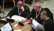 Delegates vote to approve a synthesis report at the conclusion of the Synod on Synodality on Oct. 28, 2023.