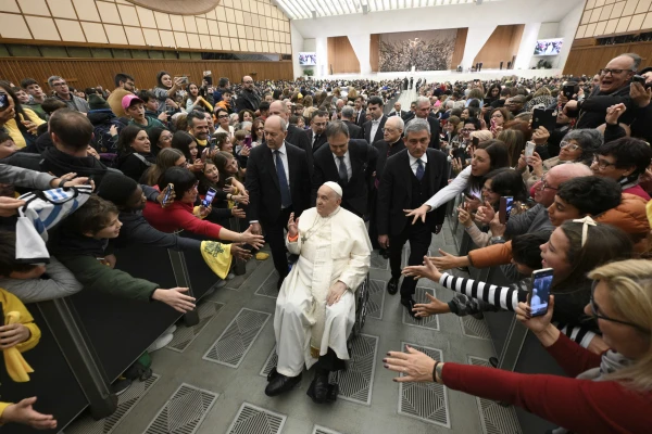 Faithful reach out to greet Pope Francis as he makes his way through the crowd in the Vatican's Paul VI Audience Hall during the first jubilee audience of 2025. Credit: Vatican Media