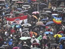 Umbrellas dot St. Peter’s Square on the rainy Sunday afternoon as jubilee pilgrims brave the weather to hear Pope Francis give his Angelus message on Jan. 5, 2025.