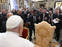 A group of comedians and humorists, including Chris Rock and Jimmy Fallon (center), share a lighthearted exchange with Pope Francis during a gathering with the pope in the Apostolic Palace at the Vatican on June 14, 2024.