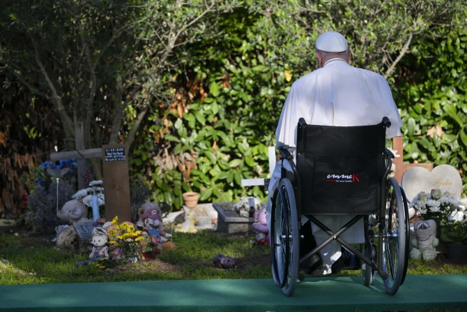 Pope Francis prays at the “Garden of Angels”