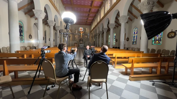 Tim Moriarty, director of the upcoming film "Roadmap to Reality: Carlo Acutis and Our Digital Age," interviews Bishop Andrew Cozzens of Crookston, Minnesota, chair of the National Eucharistic Revival, during the making of the new documentary. Credit: Courtesy of Castletown Media