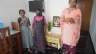 A family gathers in a prefabricated house donated by the Philokalia Foundation in Kerala state in India.