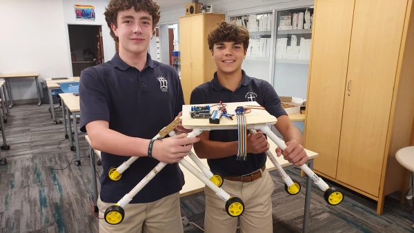 Students at St. Mary's Catholic School in the Diocese of Richmond, Virginia, pose show off a prototype model for NASA's Human Exploration Rover Challenge. Credit: Peter Tlusty