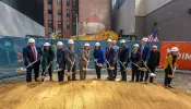 Officials break ground at a 19-story affordable housing project in downtown Boston on Tuesday, Sept. 24, 2024.