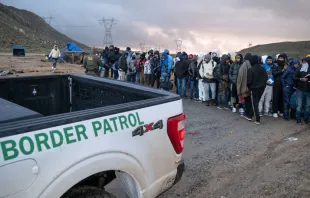 Asylum seekers wait in line to be processed by the Border Patrol at a makeshift camp near the U.S.-Mexico border east of Jacumba, San Diego County, California, Jan. 2, 2024. Credit: GUILLERMO ARIAS/AFP via Getty Images