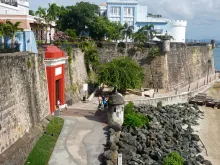 Scene of the walled city of Old San Juan, Puerto Rico. The oldest governor's mansion under the American flag, La Fortaleza, is top right.