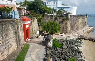 Scene of the walled city of Old San Juan, Puerto Rico. The oldest governor's mansion under the American flag, La Fortaleza, is top right. Credit: Wikimedia Commons