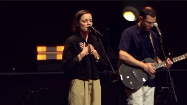 Sarah Kroger, a Catholic worship leader, takes part in leading the faithful in praise and worship at the National Eucharistic Congress in Indianapolis. Credit: EWTN Livestream