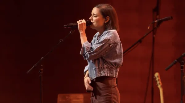 Sarah Kroger, a Catholic worship leader, takes part in leading the faithful in praise and worship at the National Eucharistic Congress in Indianapolis. Credit: EWTN Livestream