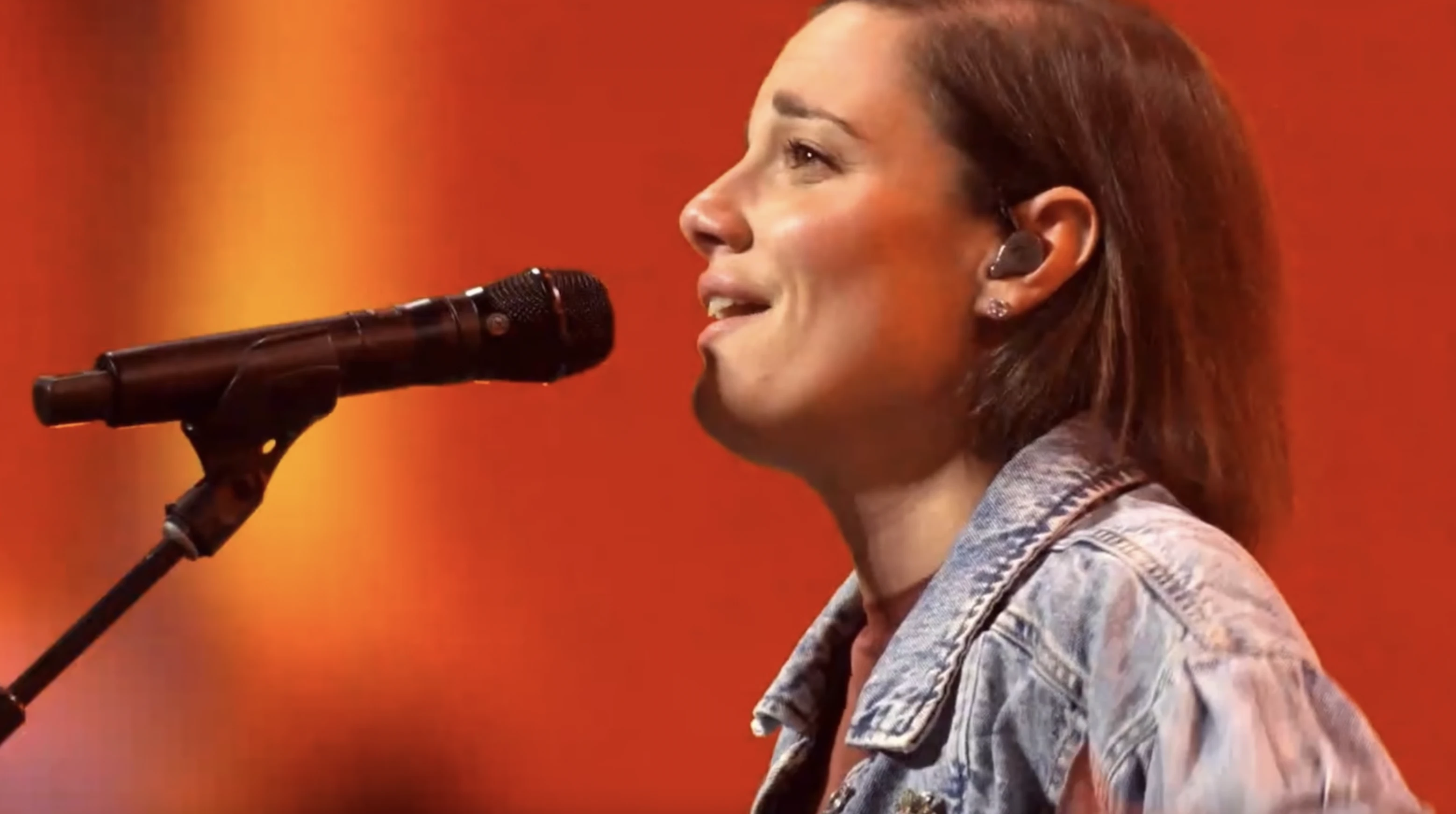 Sarah Kroger, a Catholic worship leader, takes part in leading the faithful in praise and worship at the National Eucharistic Congress in Indianapolis.?w=200&h=150