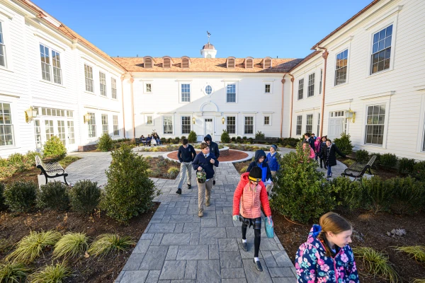 Seventh and fourth graders in the courtyard at St. Benedict Classical Academy on opening day, Dec. 2, 2024. Credit: Adam Richins Photography