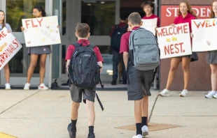 Bishop Ireton High School upperclassmen welcome freshman students on their first day of school for the 2024-2025 phone-free school year. Credit: Photo courtesy of Bishop Ireton High School