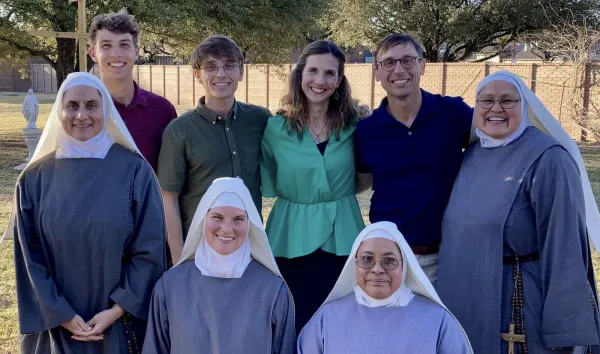 Anndrea Stamey, center, and her family on the day that she became an oblate with the Sisters of Mary Morning Star. Sister Pia Maria is at right. Credit: Photo courtesy of Anndrea Stamey