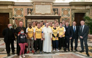 Pope Francis with members of the ‘Pope’s Team - Fratelli tutti’ in the Vatican’s Clementine Hall, Nov. 20, 2021. Vatican Media.