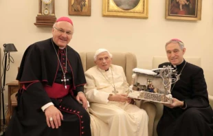 Bishop Rudolf Voderholzer, Pope emeritus Benedict XVI, and Archbishop Georg Gänswein with the nativity scene on Dec. 8, 2021. Diocese of Regensburg.