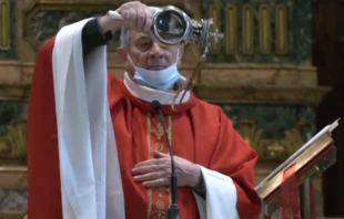 The reliquary of St. Januarius is held by the celebrant at Mass in Naples Cathedral, Italy, Dec. 16, 2021. Screenshot from canale21.it.