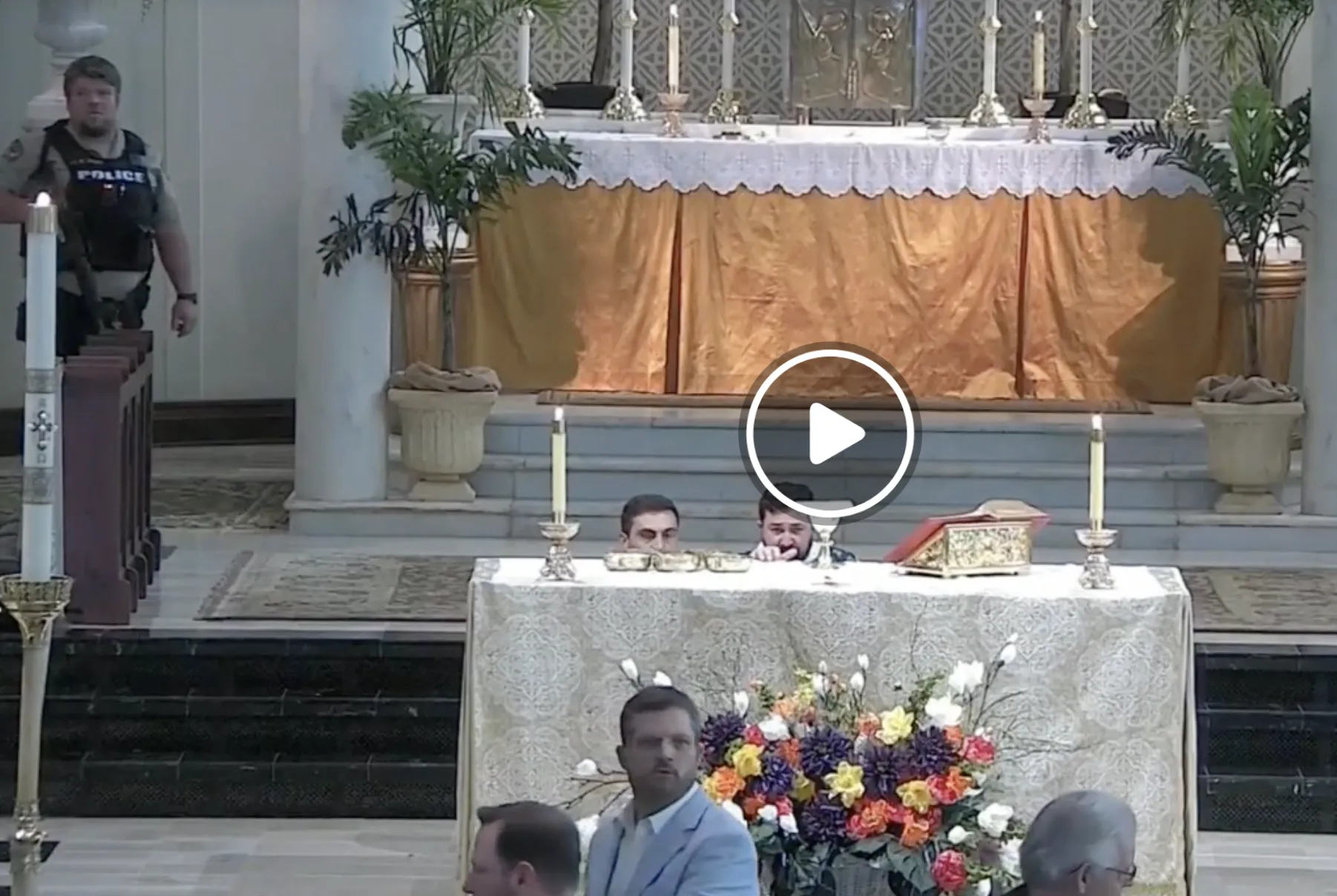 As parishioners and police respond to the threat of an armed intruder, clergy at St. Mary Magdalene Catholic Church in Abbeville, Louisiana take cover behind the altar on May 11, 2024.?w=200&h=150