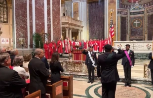 The faithful stand at attention for the national anthem at the archdiocesan Red Mass at the Cathedral of St. Matthew the Apostle, Sunday, Oct. 6, 2024. Credit: Archdiocese of Washington