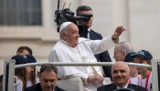 Pope Francis greets pilgrims at his general audience at the Vatican on Wednesday, Oct. 16, 2024.