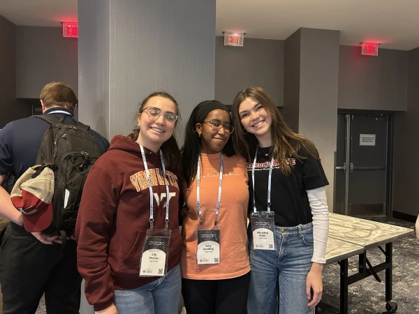 Virginia Tech students Lily Veccia, Amy Gooding, and Meredith Klote pose for the camera at SEEK25 in Washington, D.C. Credit: Madalaine Elhabbal/CNA