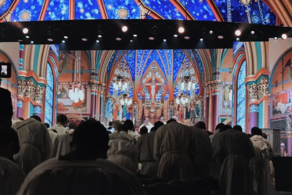 Priests bow during the consecration at the opening Mass at SEEK25 in Salt Lake City on Jan. 1, 2025. Credit: Kate Quiñones/CNA