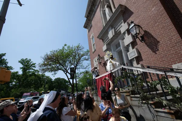 Bishop Gerardo Colacicco, an auxiliary bishop of the Archdiocese of New York, blesses pilgrims with the Eucharist outside the Shrine of St. Elizabeth Ann Bayley Seton in Lower Manhattan on May 26, 2024. The shrine was a stop on the New York City leg of the National Eucharistic Pilgrimage. Credit: Jeffrey Bruno/CNA