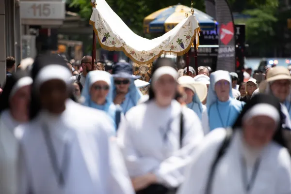 Pilgrims walk through Lower Manhattan during a National Eucharistic Pilgrimage procession through New York City on May 26, 2024. Credit: Jeffrey Bruno/CNA