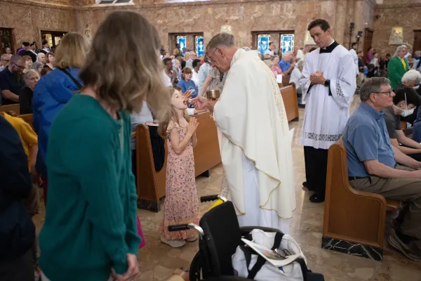 A young girl receives the Blessed Host at the Basilica of Saint Elizabeth Ann Seton on June 6, 2024. Credit: Jeffrey Bruno