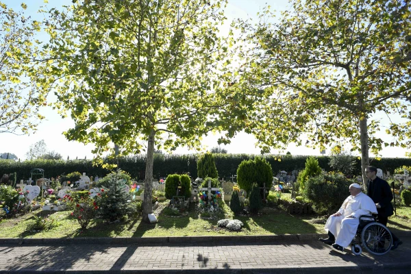 Pope Francis visits the “Garden of Angels” section of the Laurentino cemetery, including recent graves, marked with colorful stuffed animals and personal memorials from grieving families, on All Souls’ Day, Nov. 2, 2024. Vatican Media