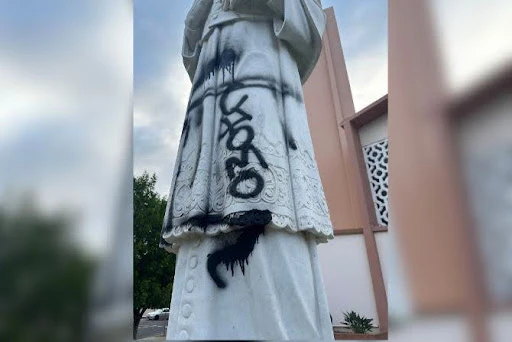 The statue of the patron saint of St. Francis de Sales Parish in Sherman Oaks has been vandalized three times total in September and August. The vandalism in the photograph is being investigated as a “hate crime” by local police, according to the church's pastor.?w=200&h=150