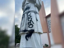 The statue of the patron saint of St. Francis de Sales Parish in Sherman Oaks has been vandalized three times total in September and August. The vandalism in the photograph is being investigated as a “hate crime” by local police, according to the church's pastor.