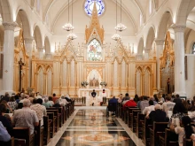 The faithful adore Christ in the Blessed Sacrament at Adoration Sodality Day at the Shrine of the Most Blessed Sacrament.