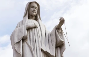 A statue of the Virgin Mary outside the Pfarrkirche St. Alban in Matrei in Osttirol, Austria. josefkubes via Shutterstock.