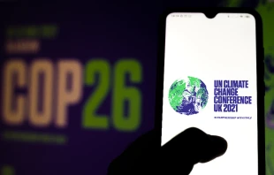 The 2021 UN Climate Change Conference (COP26) logo displayed on a smartphone. Rafapress via Shutterstock.