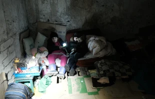 Children shelter in a basement in Mariupol, southeastern Ukraine, amid Russian bombardment on March 5, 2022. Vladyslav Babenko via Shutterstock.