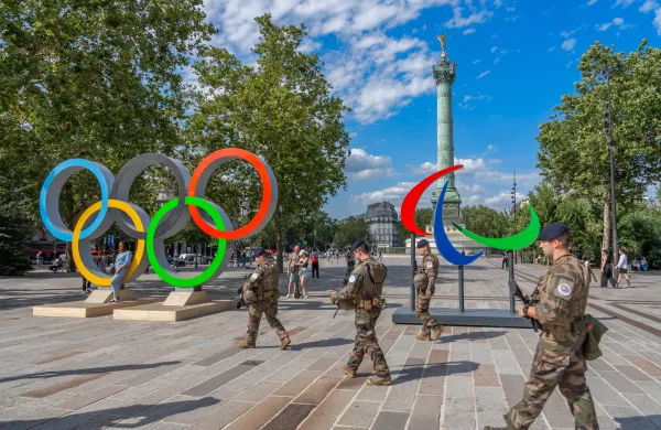 French soldiers patrol the Place de la Bastille in days before the Olympic and Paralympic games in Paris. Credit: Franck Legros|Shutterstock